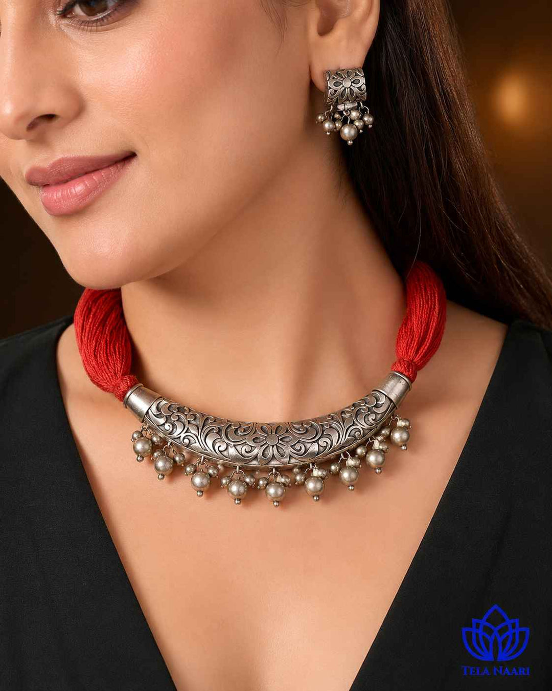 Layered silver-plated finish gives this necklace its antique charm.