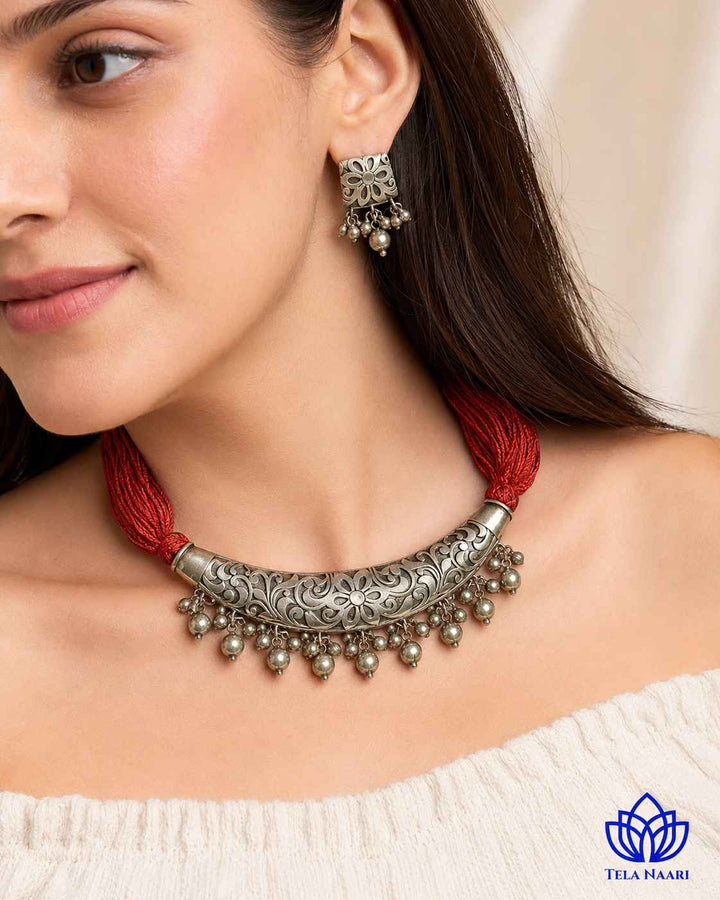 Matching earrings complete this silver-plated thread necklace set.