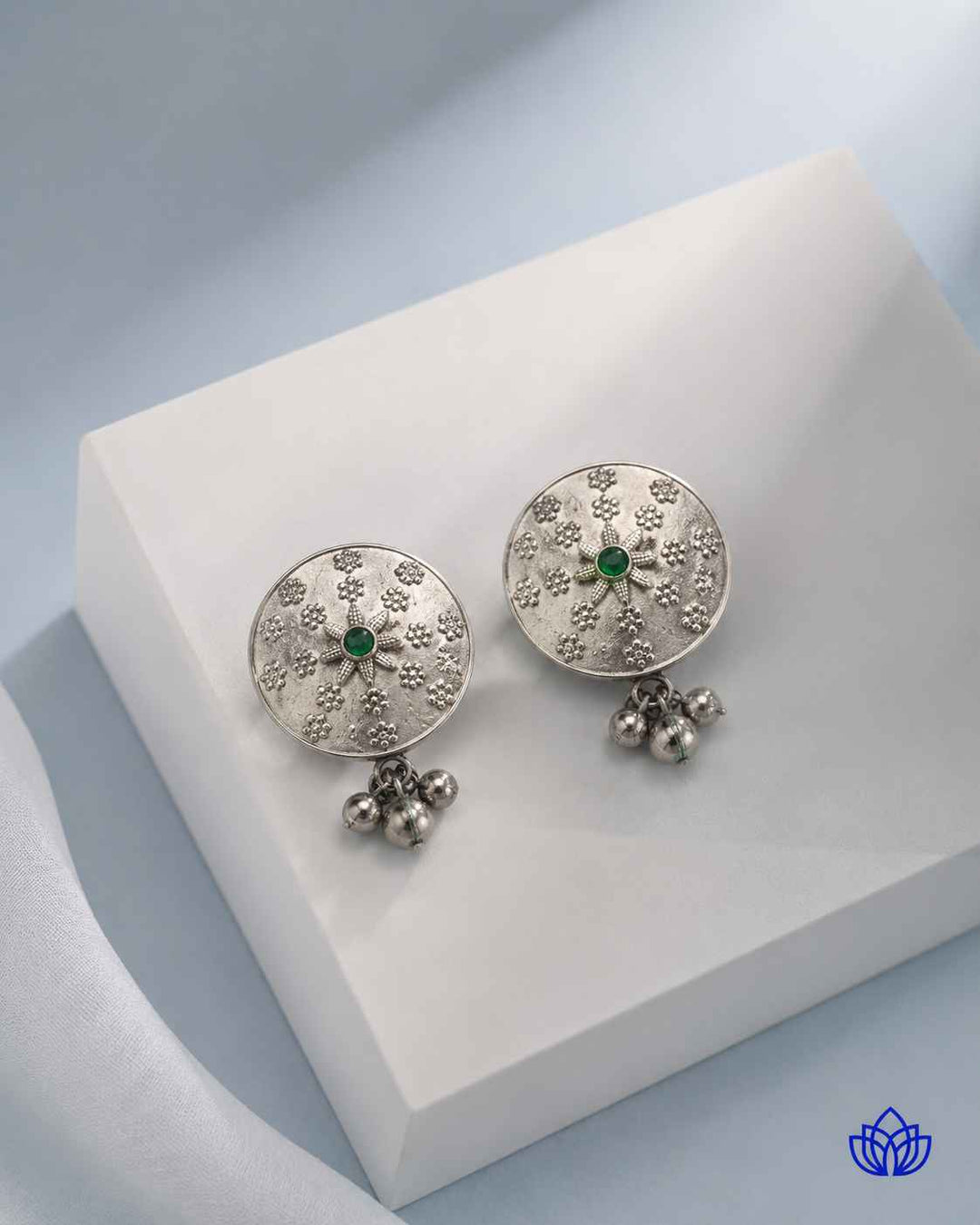 Matching earrings complete this green stone necklace set.