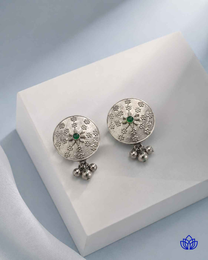 Matching earrings complete this green stone necklace set.