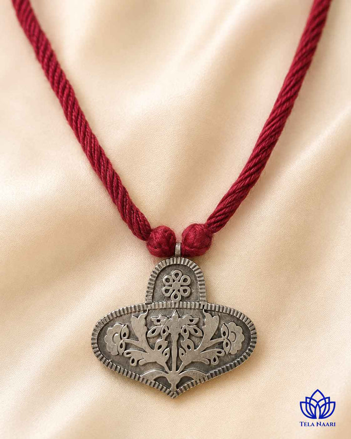 Matching earrings complete this red thread necklace set.