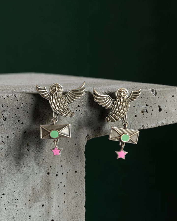 Mystical owl detailing shapes the silhouette of this oxidised earring.