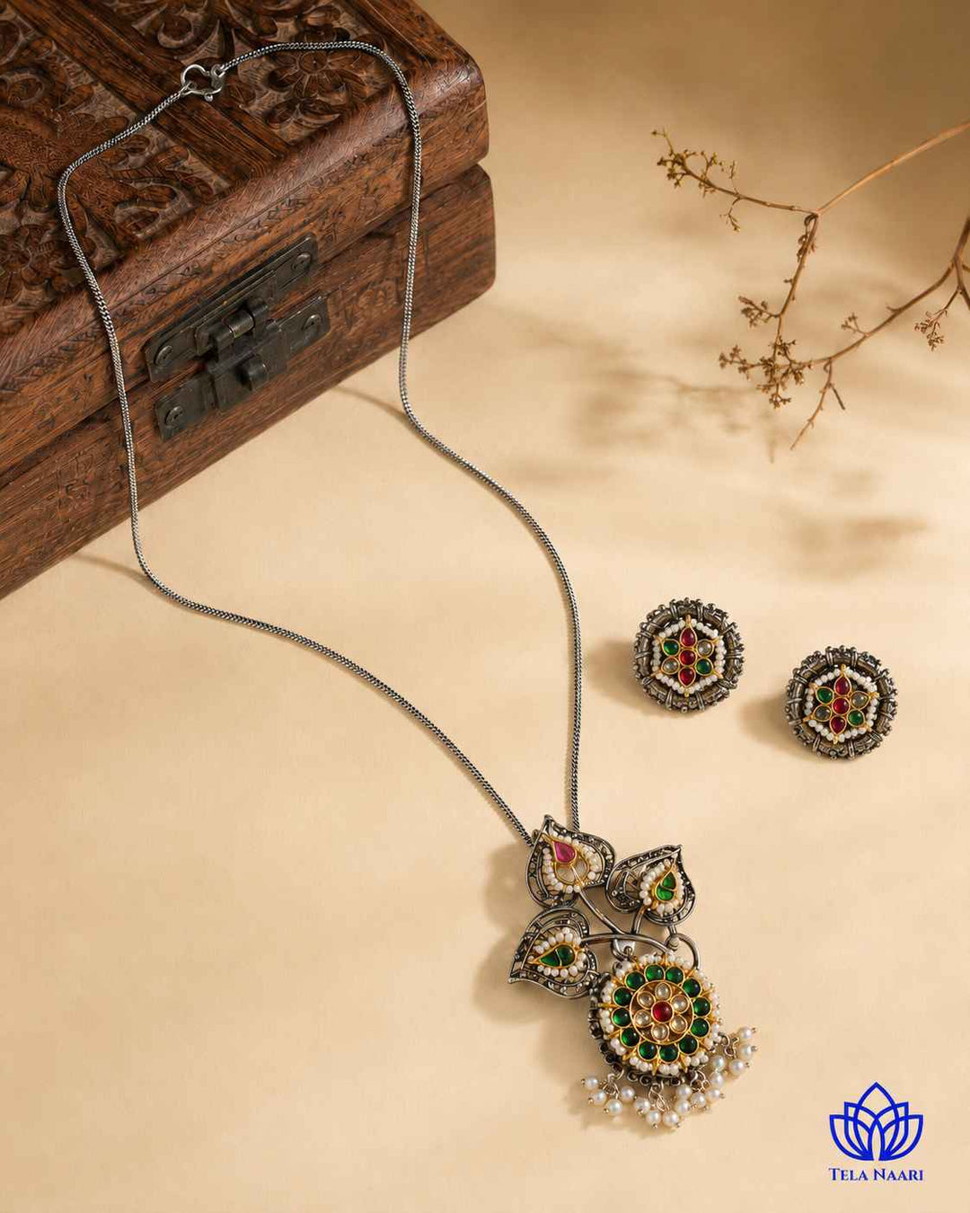 Oxidised finish highlights the traditional detailing of this necklace.