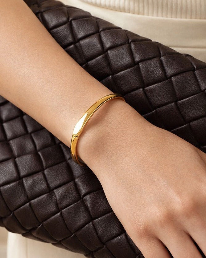 Everyday elegance defines the design of this minimalist gold cuff.