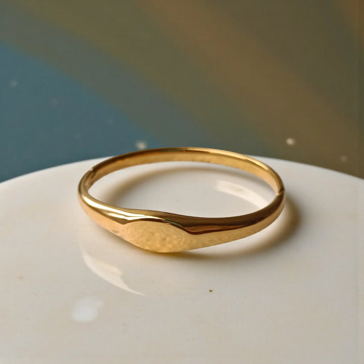 Stainless steel construction supports the wave design of this cuff.