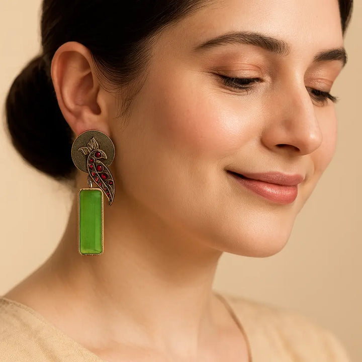 Model wearing Begunia silver plated earrings – elegant Indian ethnic jewellery by Tela Naari
