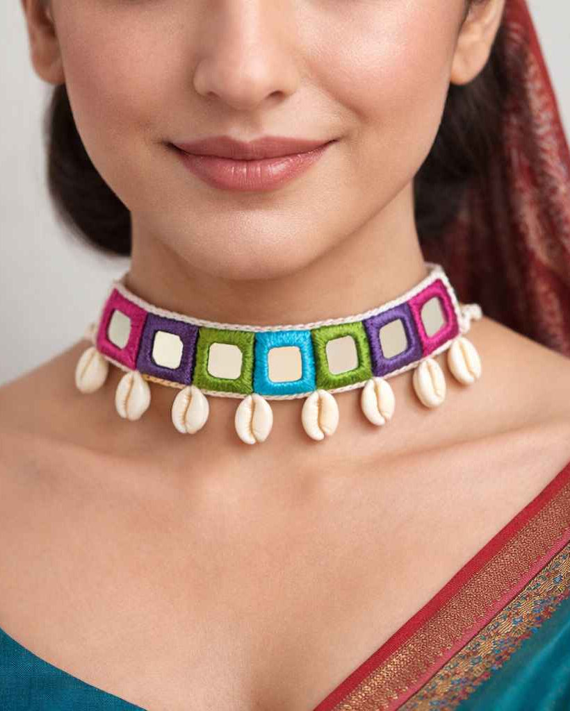 Vivid threadwork shapes the silhouette of this handmade choker.