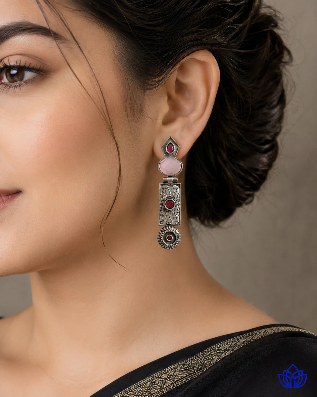 Push-back closure secures this oxidised pink statement earring.