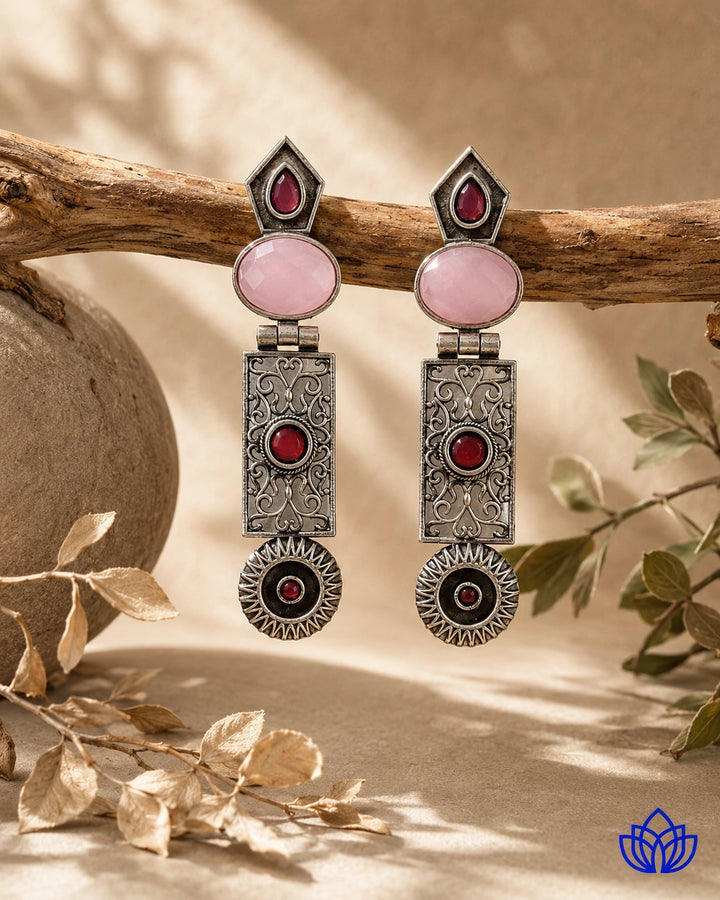 Sophisticated silhouette defines the shape of this statement earring.