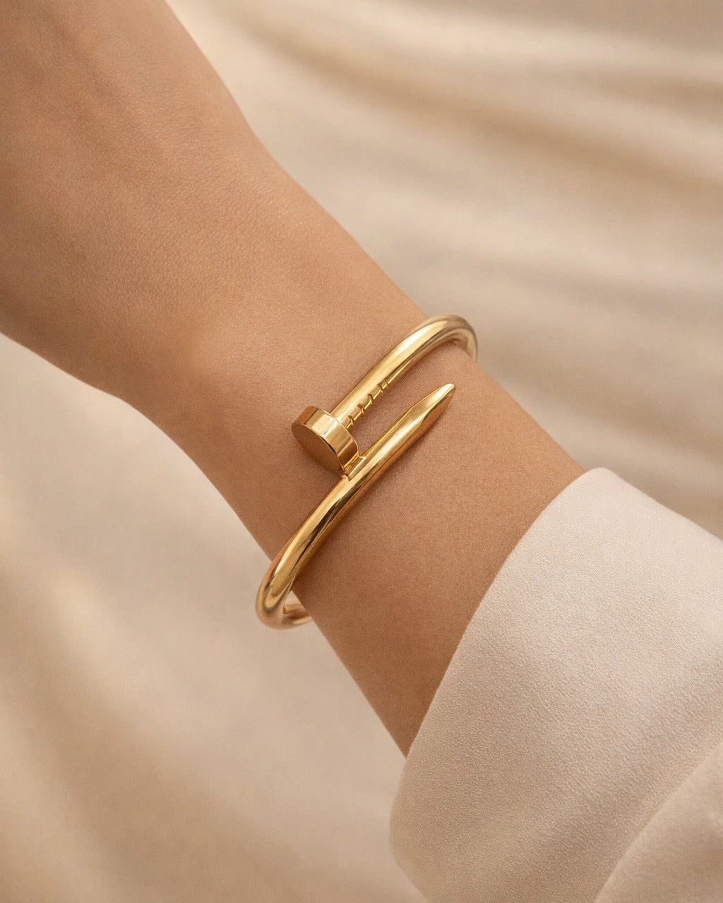 Nail-head studs decorate the surface of this anti-tarnish cuff bracelet.