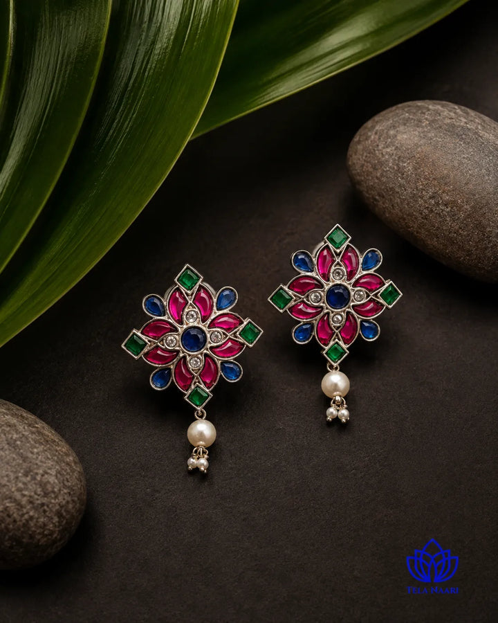 Antique oxidised finish gives this pearl stud its darkened charm.