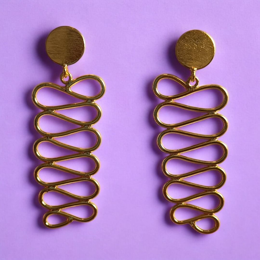 Bold spiral detailing shapes the teardrop silhouette of this earring.