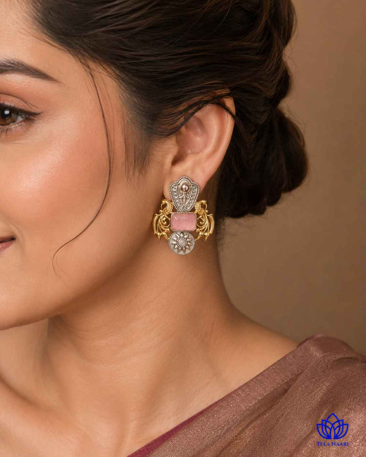 Brass construction supports the layered dual-tone plating on this earring.