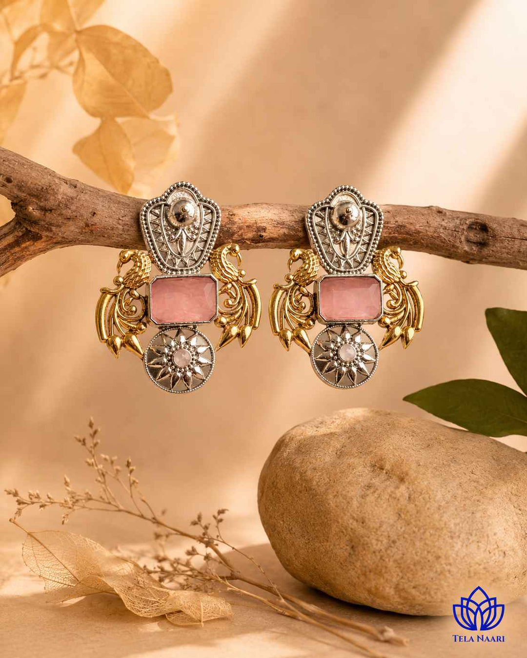 Fusion-style earring pairs pink tones with textured oxidised brass.