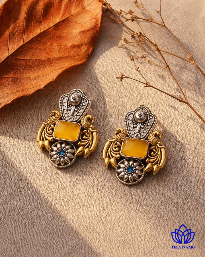 Layered oxidised plating gives this earring its dual-tone texture.
