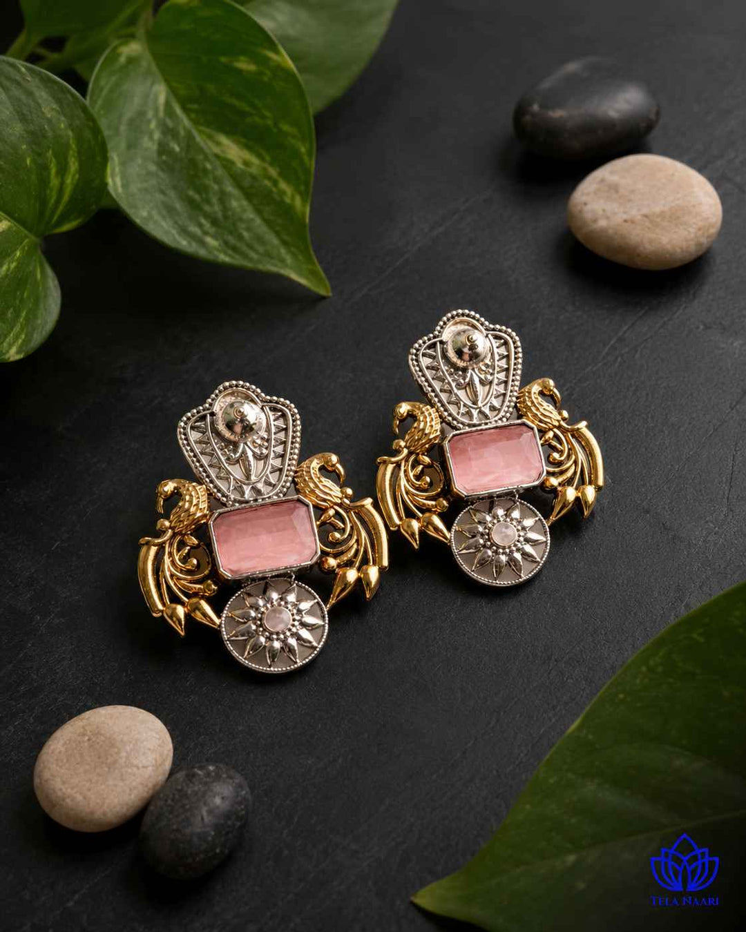 Layered dual-tone finish gives this pink earring its bold structure.