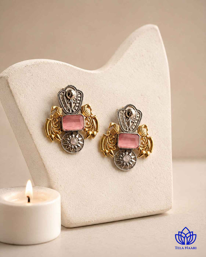 Pink dual-tone plating covers the surface of this statement earring.