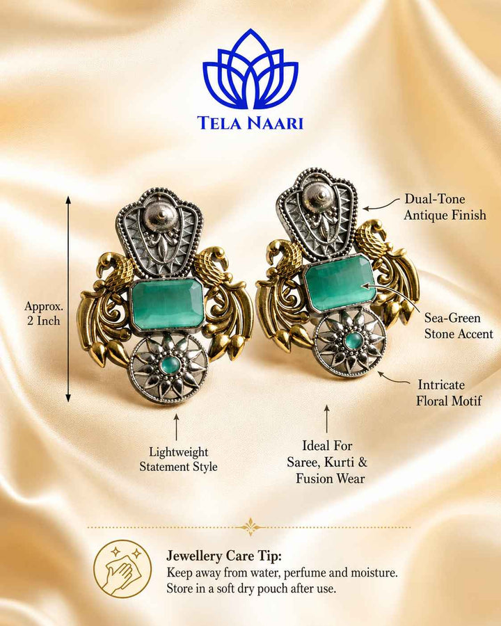 Bold silhouette pairs sea green tones with oxidised silver.