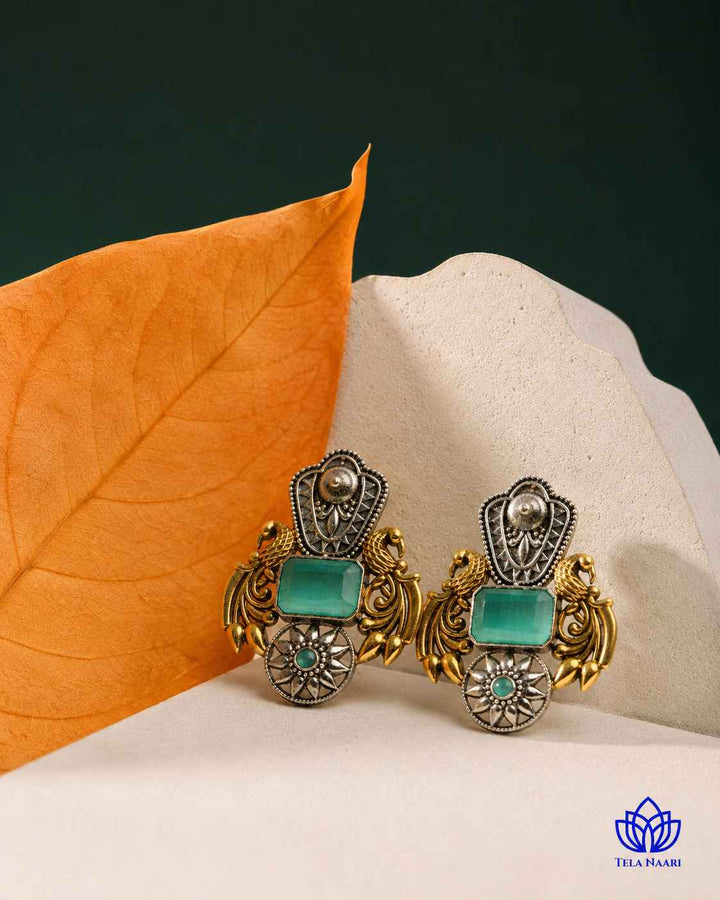 Layered plating gives this sea green earring its dual-tone texture.