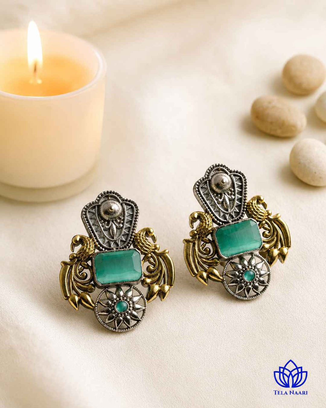 Metallic contrast defines the two-tone finish of this earring.