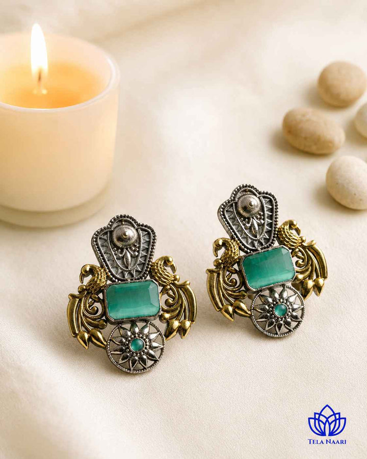 Metallic contrast defines the two-tone finish of this earring.