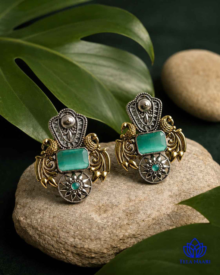 Silver oxidised finish covers half of this dual-tone earring.