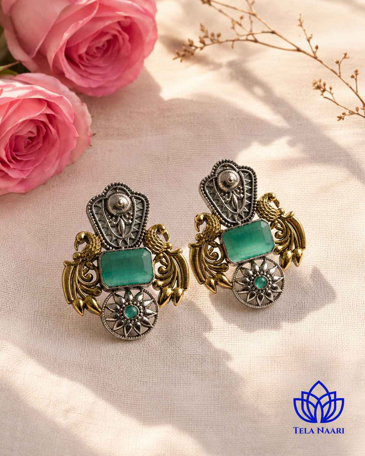 Push-back closure secures this dual-tone sea green earring.