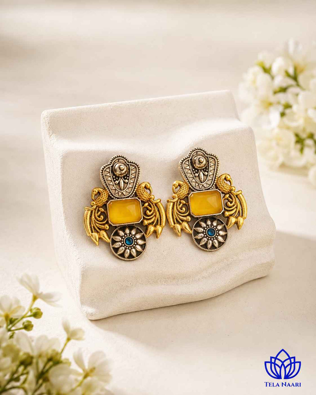 Contemporary edge defines the silhouette of this oxidised earring.