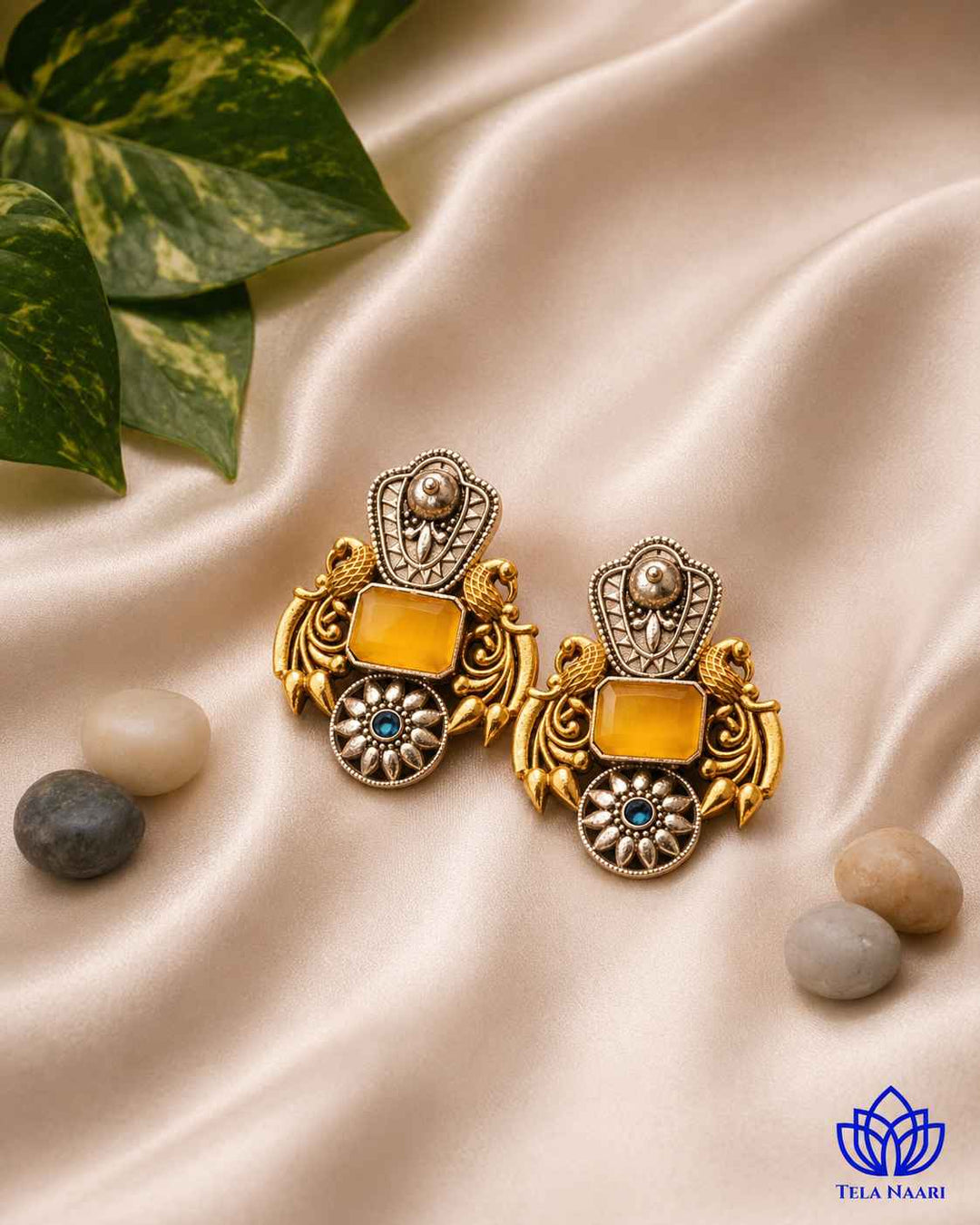 Traditional craftsmanship shines through this bold dual-tone silver oxidised earring.