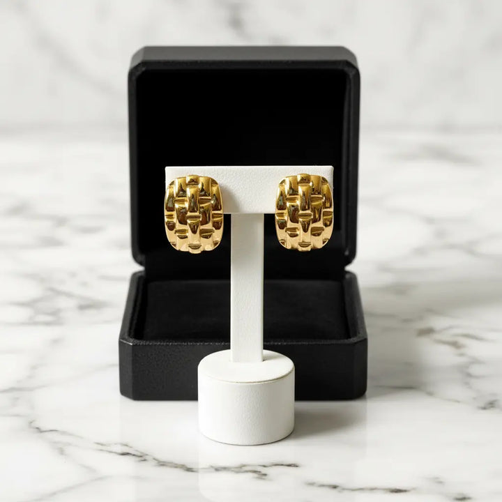 Compact stud silhouette defines the shape of this earring.