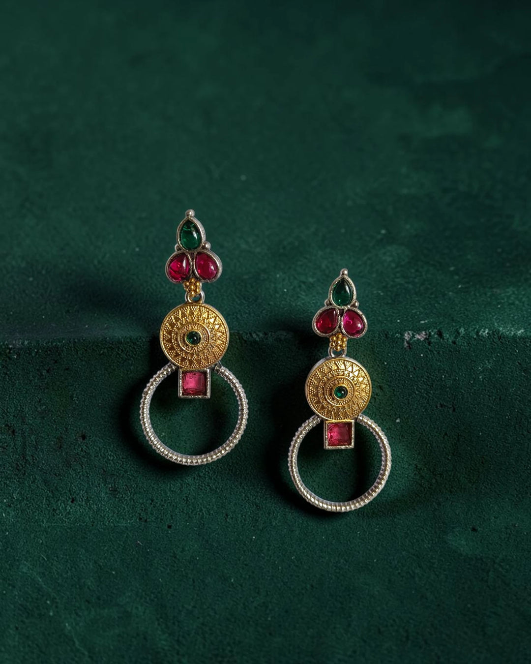 Silver-plated brass gives this dual-tone earring its polished finish.