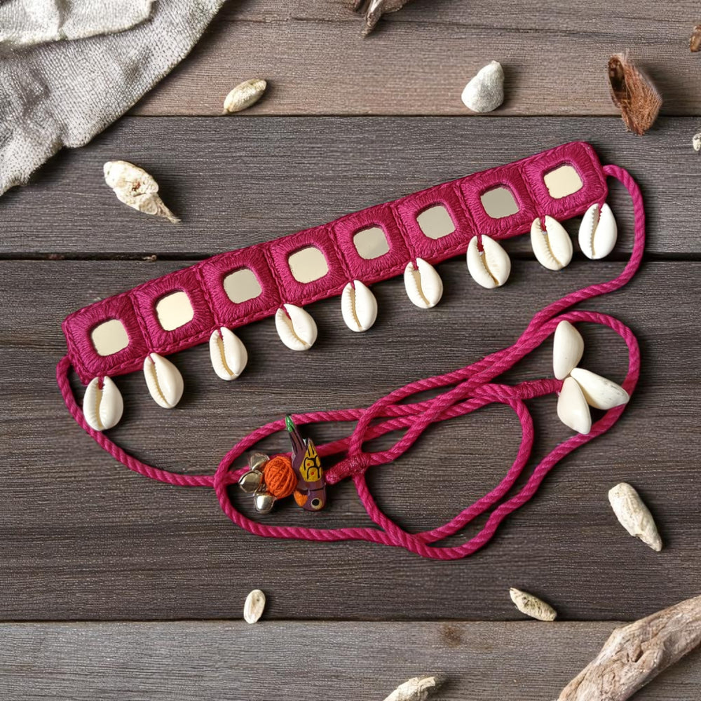 Mirror work catches the light across this pink fabric choker.