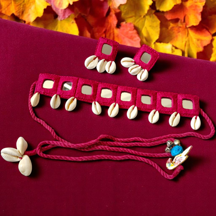 Matching earrings complete this pink mirror and shell choker set.