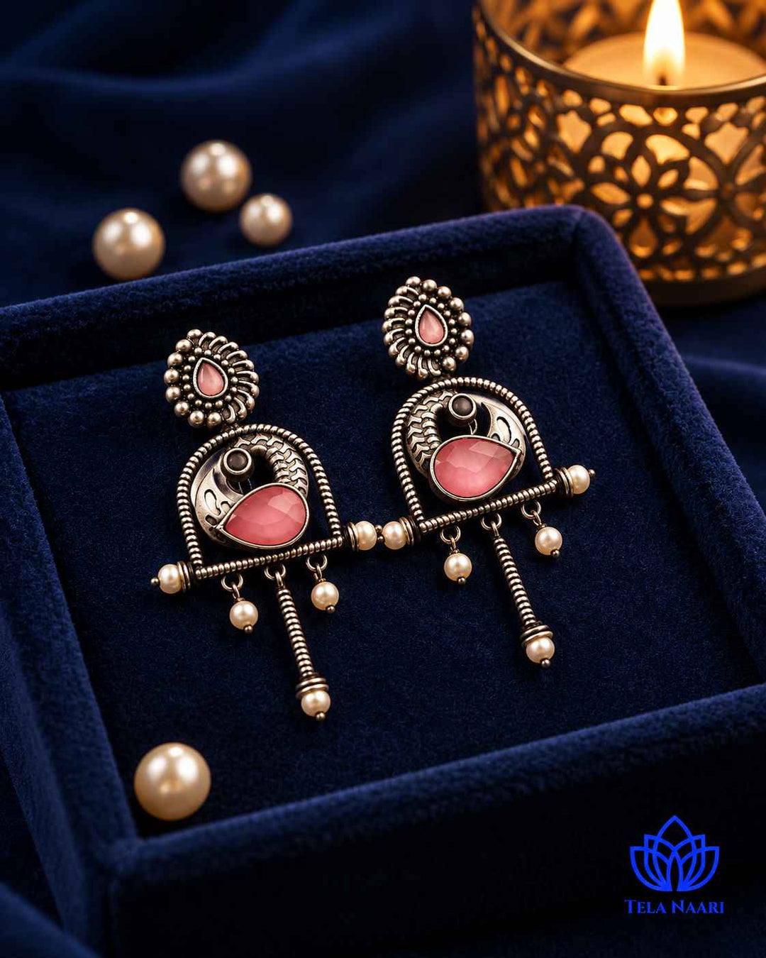 Post and back closure secures this oxidised earring in place.