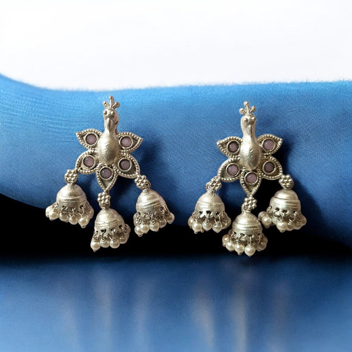 Striking peacock motif shapes the silhouette of this earring.