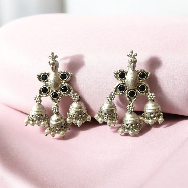 Yellow accent brings colour to this silver-plated peacock earring.