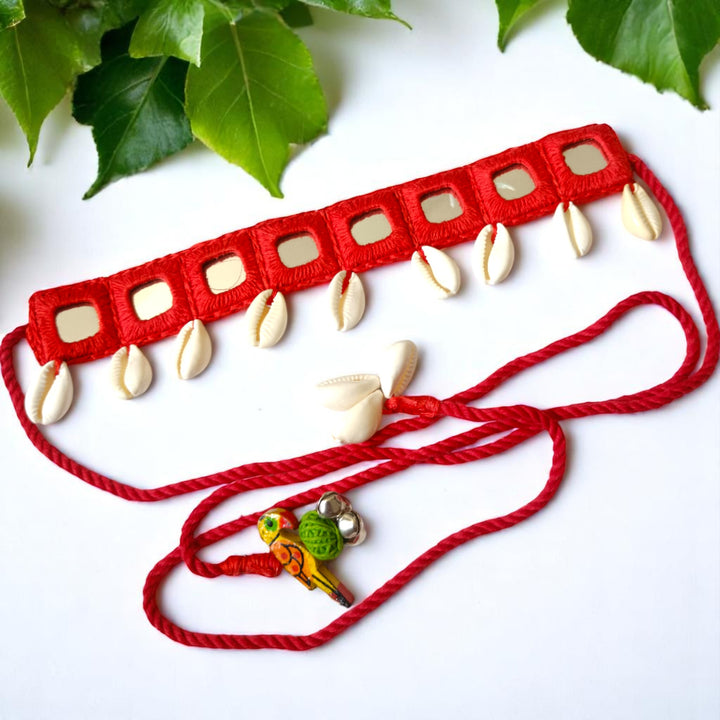 Mirror work catches the light across this red fabric choker.