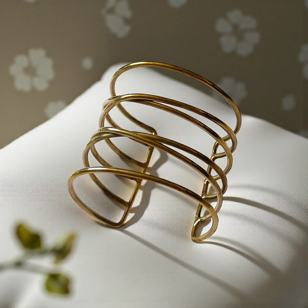 Brass construction supports the tarnish-resistant finish of this cuff.