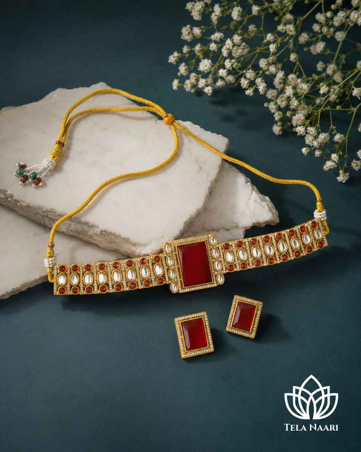 Polished gold-plated surface catches the light across this choker.