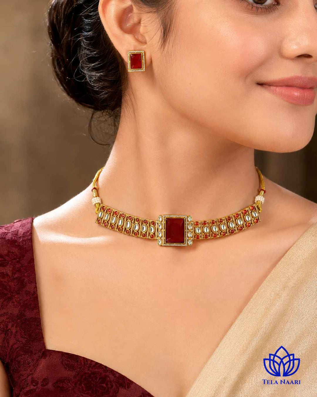 Bold red stone sits at the centre of this gold-plated choker.
