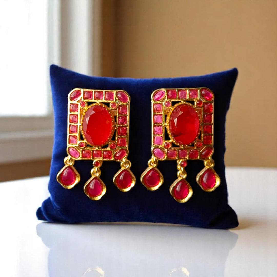 Matching drop earrings complete this ruby kundan necklace set.