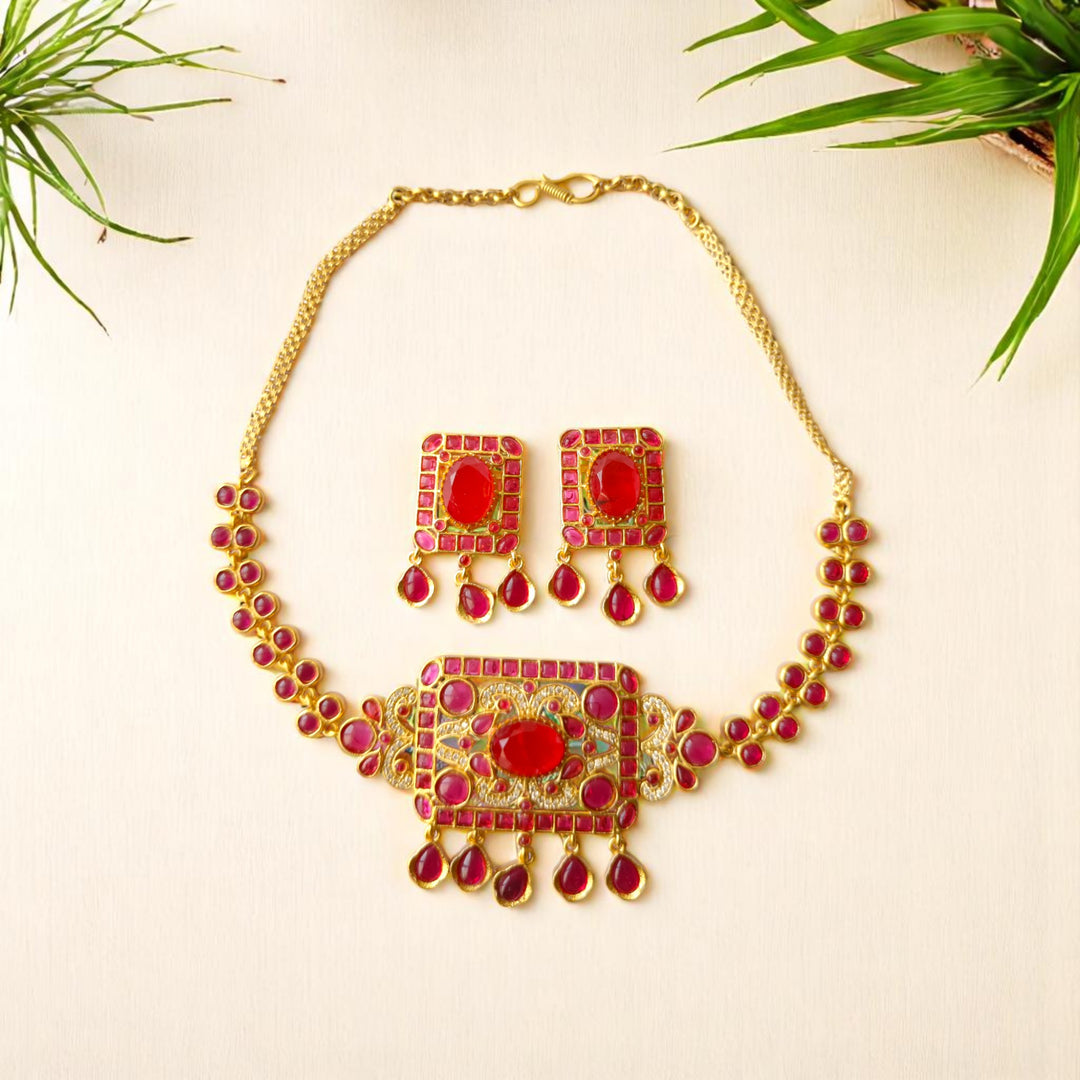 Kundan-style stone work decorates the surface of this necklace.