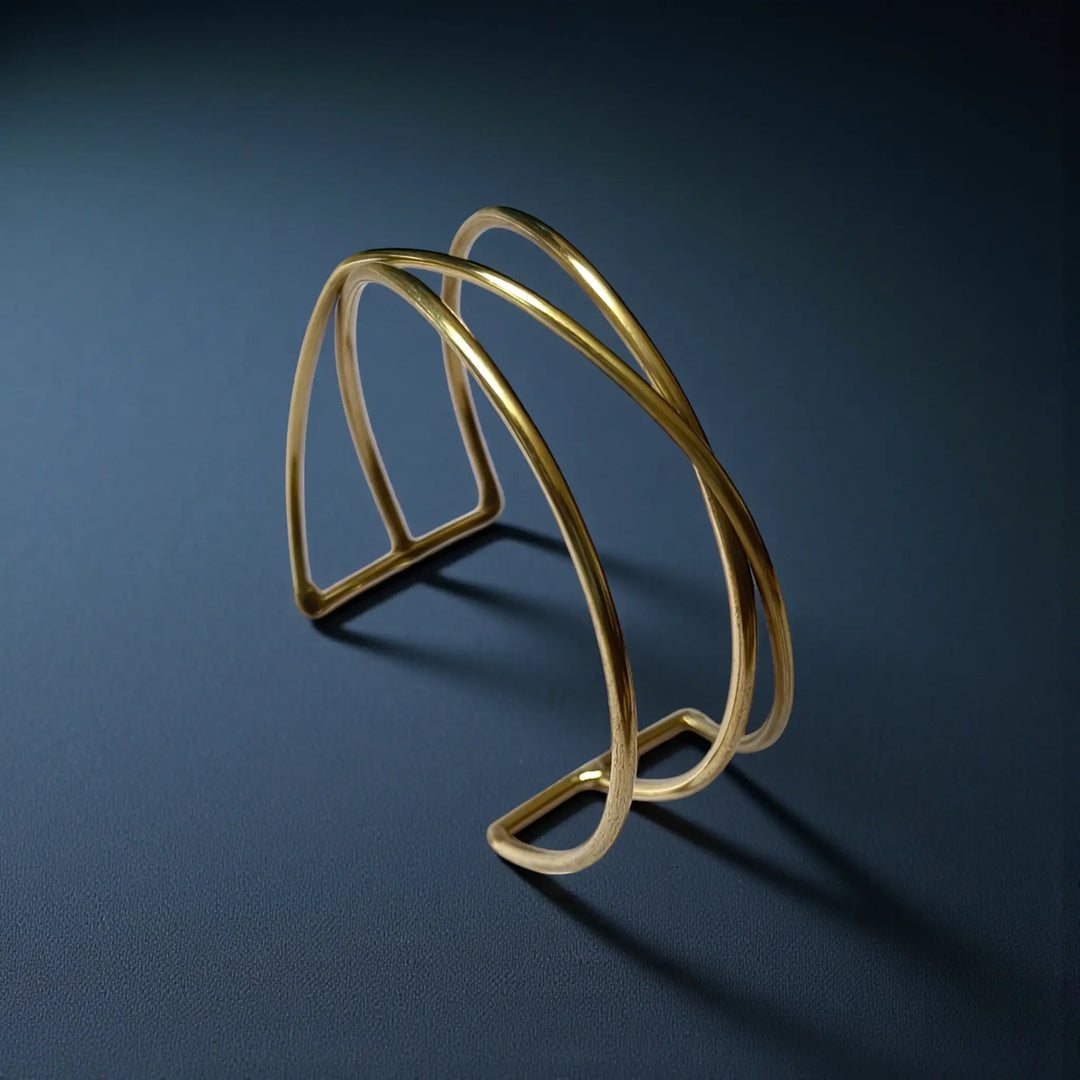 Sculpted anti-tarnish brass cuff bracelet for women with handcrafted texture and glossy gold finish
