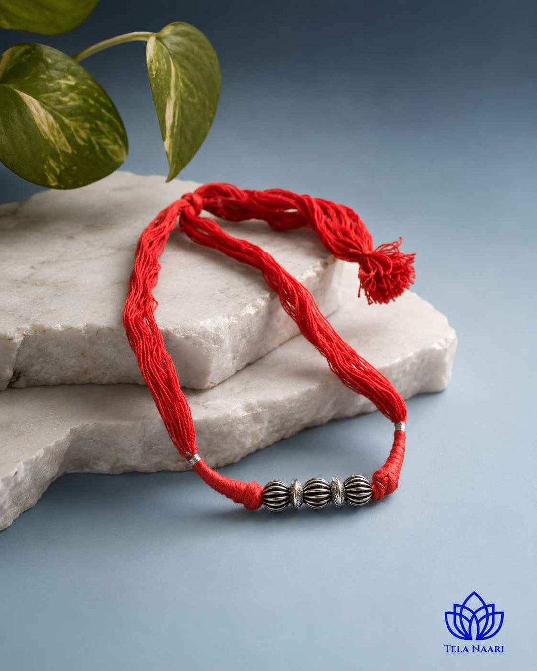 Colourful pop defines the thread detailing of this choker.