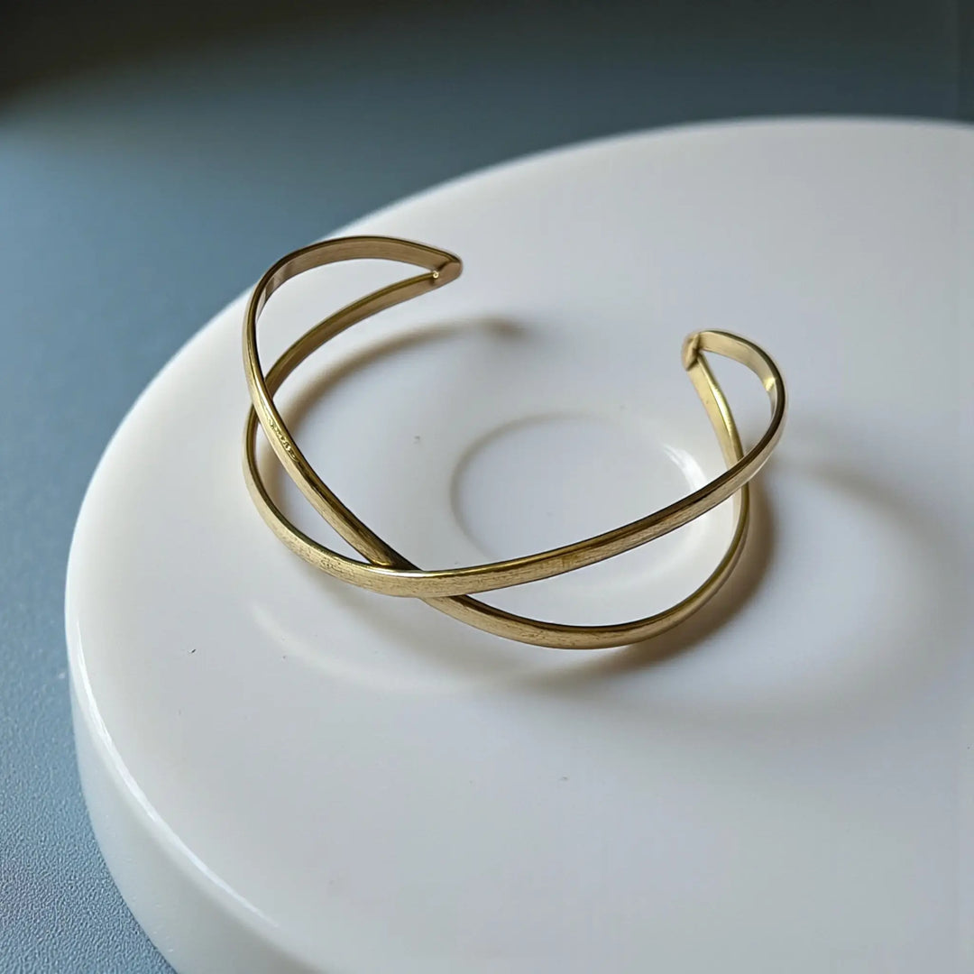 Sovereign Curve anti-tarnish cuff bracelet for women with elegant sculpted design and glossy gold tone finish
