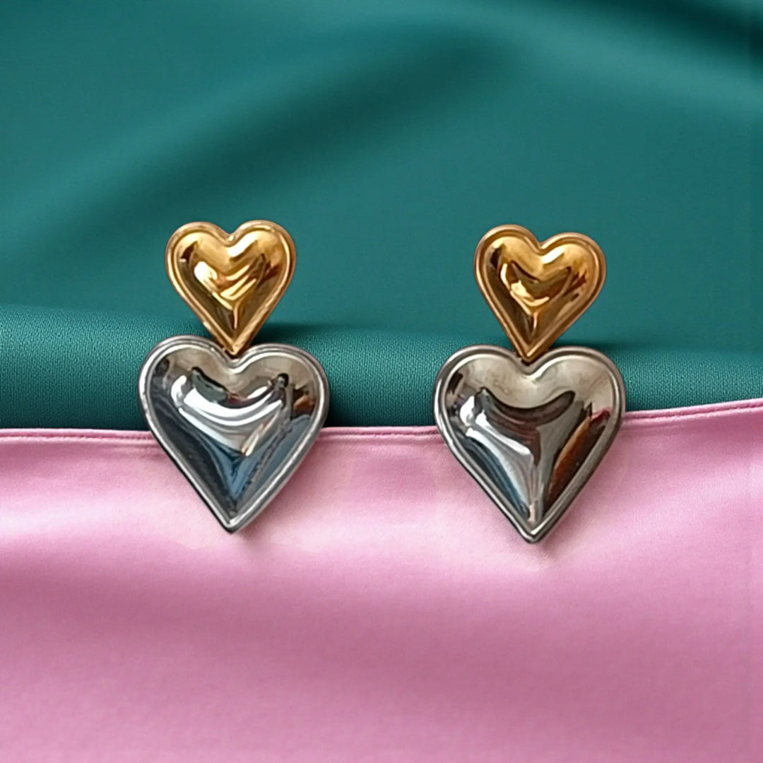 Polished surface highlights the heart silhouette of this stud earring.