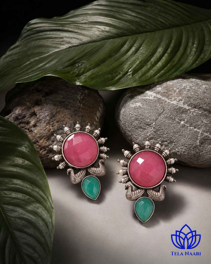 Dual-tone gemstone detailing highlights the pink tones throughout the design.