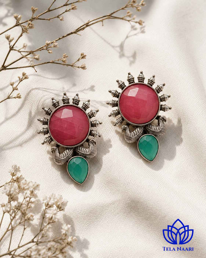 Handcrafted detailing brings texture to this sunburst earring design.