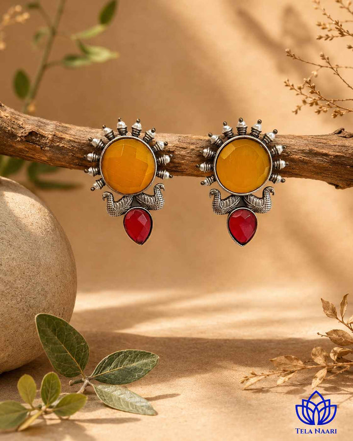Ethnic craftsmanship shapes the sunburst motif of this earring.