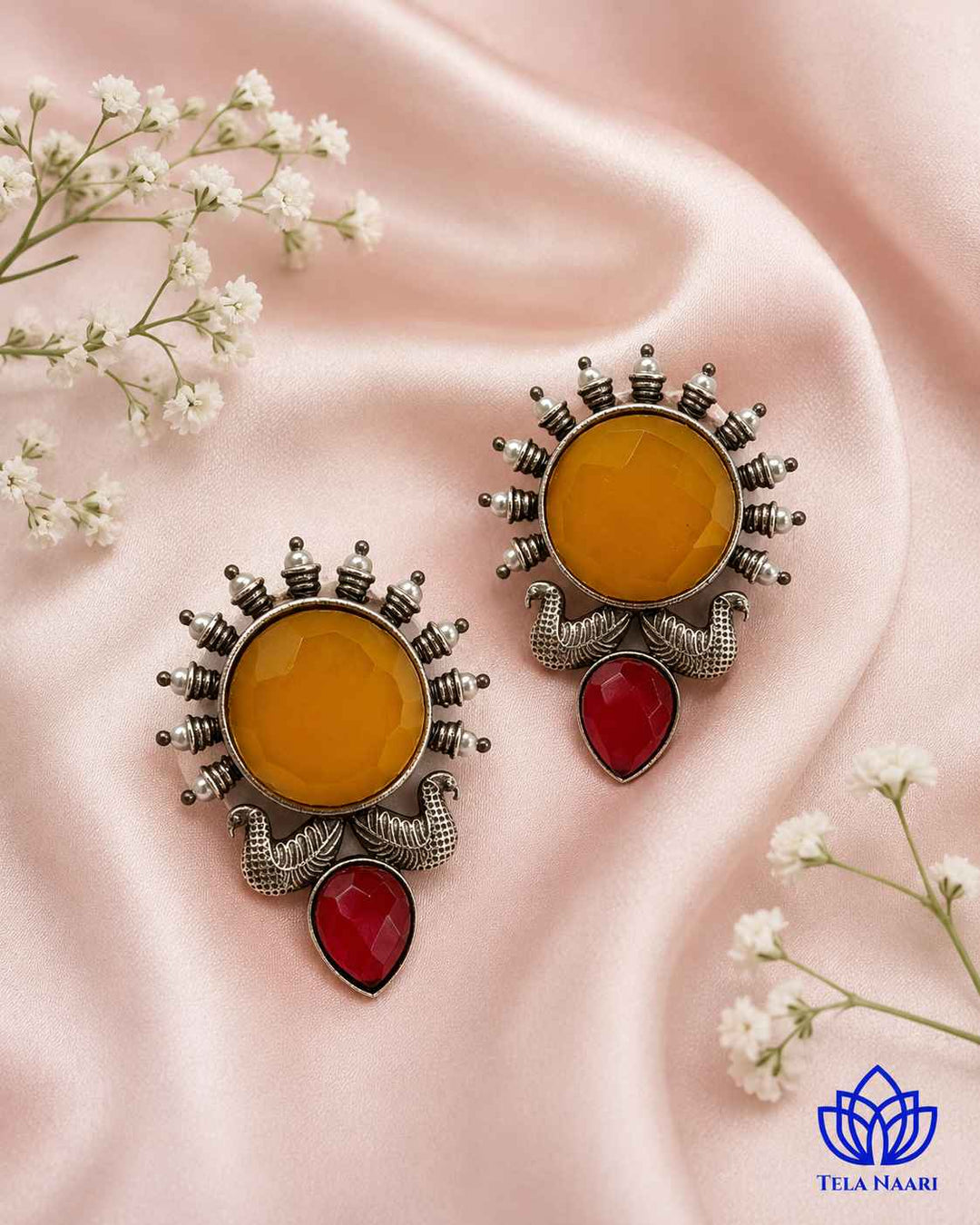 Celestial sunburst detailing shapes the silhouette of this earring.